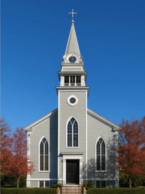 Exterior of a remodeled church from the mid-1600s with a blue sky behind
