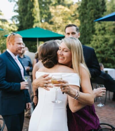 hugging the bride
