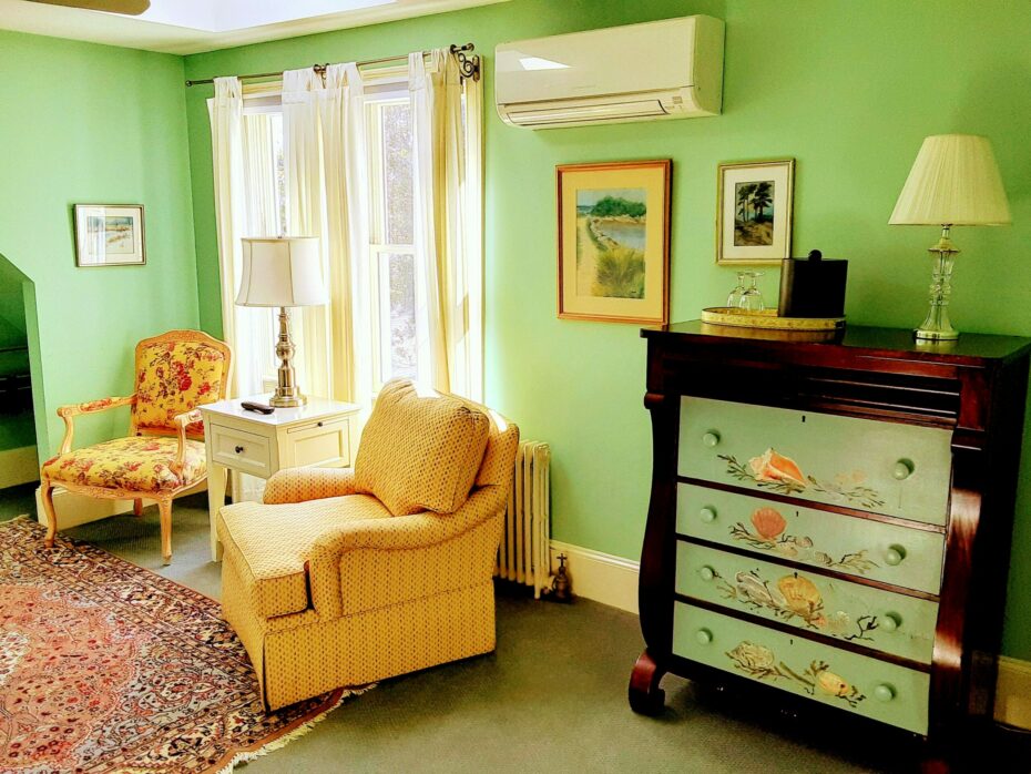 S sitting area with a shell painted chest of drawers